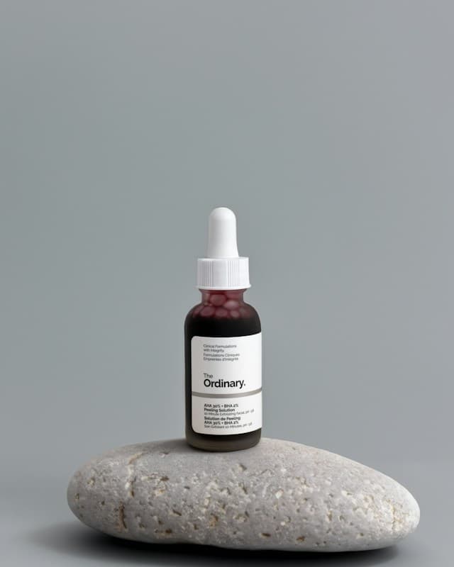 A minimalist skincare bottle photographed against a neutral background.