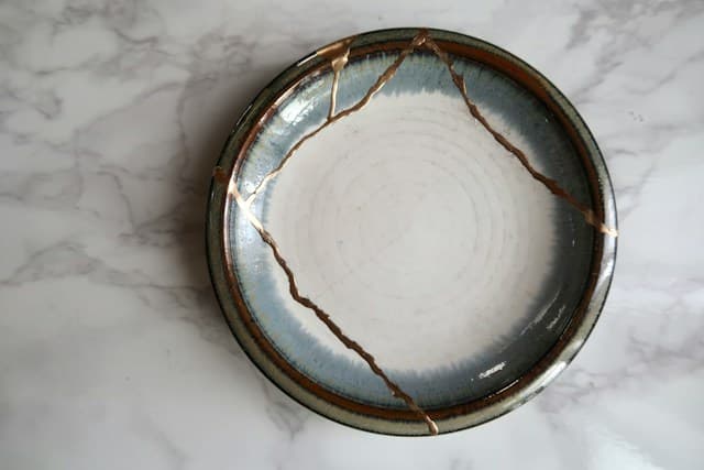 A ceramic object photographed with an emphasis on its surface and imperfections.