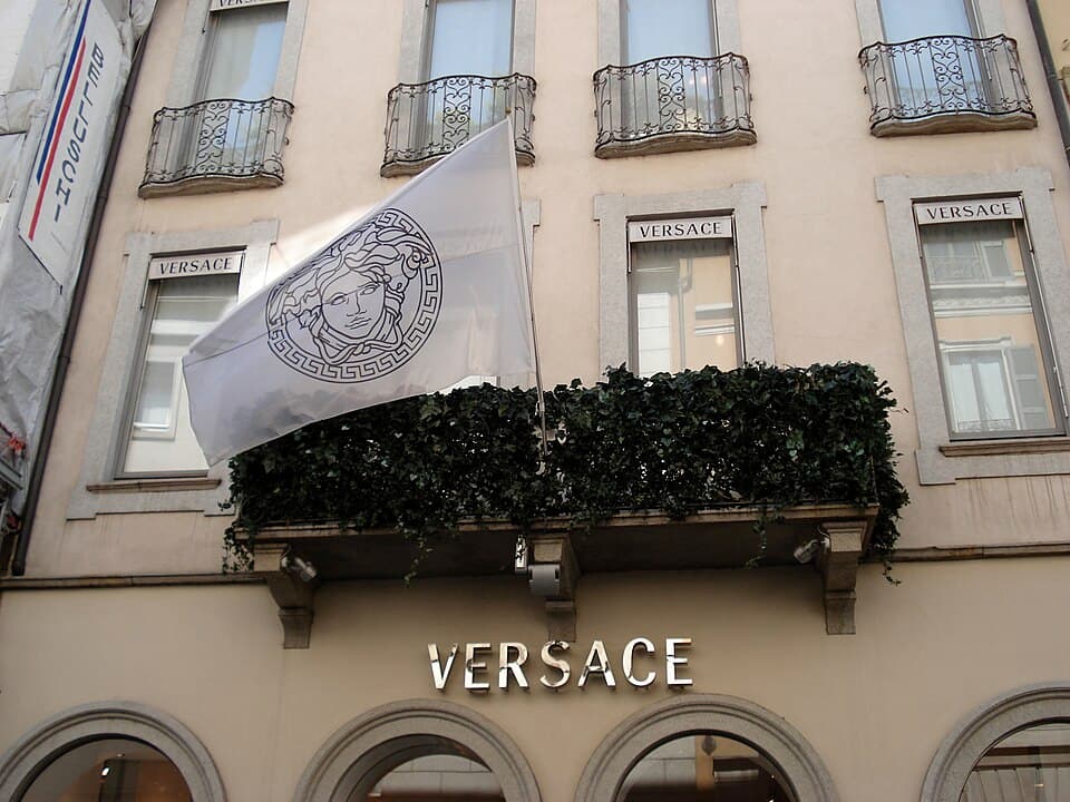 Versace boutique in Milan with a Medusa-emblem flag