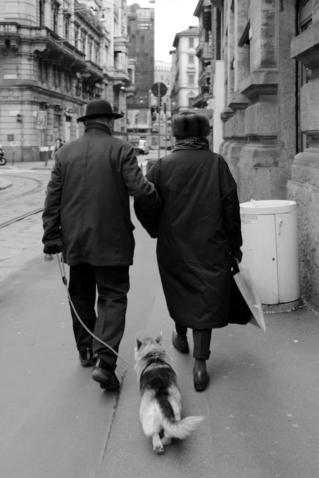 A candid black-and-white street photograph taken in Milan
