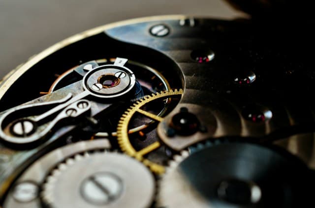 A close-up of the intricate gears and metal components inside a mechanical watch movement